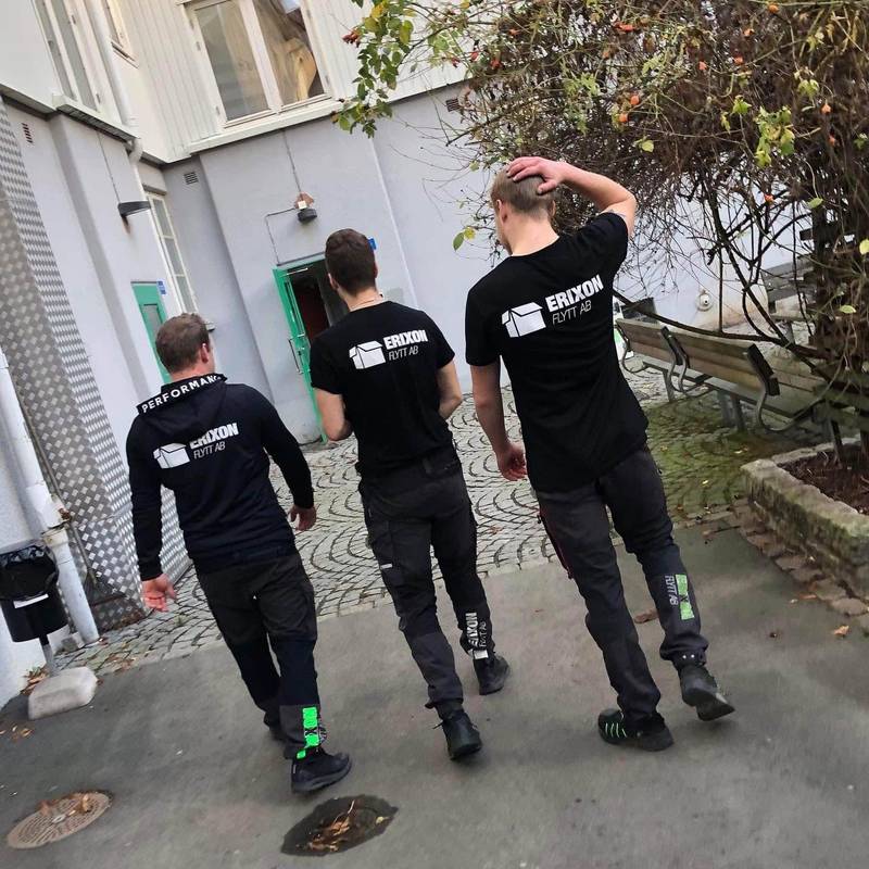 Staff members and movers standing together outdoors